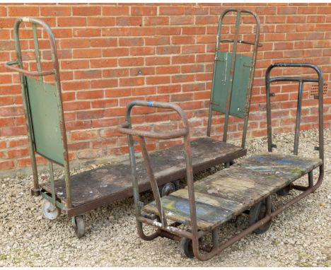 Two platform trolleys.First 190cm wide x 39cm deep x 129cm high; second 154cm wide x 45.5cm deep x 93cm highQty: 2Some oxidis