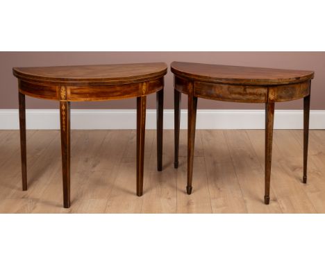The tops with crossbanded borders, opening to reveal green baize insets. The first with tapering square section legs terminat
