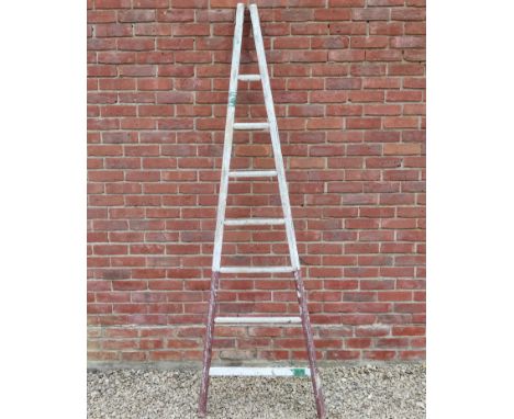 A white painted orchard ladder.232cm highGenerally good condition, wear commensurate with age and use, frame generally sound 