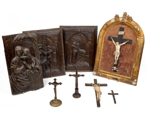 To include a carved mahogany panel depicting the Virgin and Child; two carved oak panels of Dutch scenes possibly from cupboa