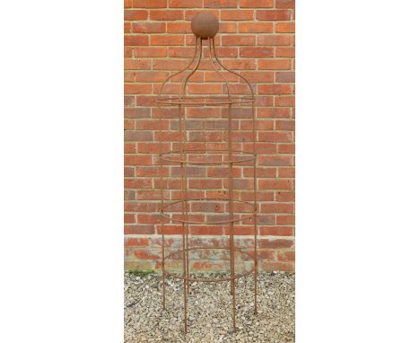 The plant support of circular section with ball finial.54cm diameter x 170cm highIn oxidised, good condition.