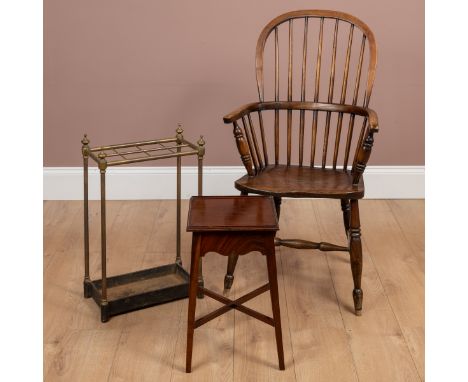 To include an elm seated Windsor chair with yew wood frame, the turned legs united by an H framed stretcher; a brass and iron