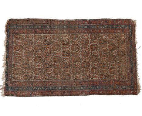 Comprising a small 20th century hand-woven Caucasian rug with an all-over pattern on a cream ground, with multiple borders; a