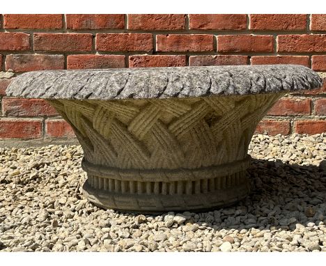 The cast reconstituted stone planter with flaring rim.78cm diameter x 34cm highIn weathered but generally good condition, wit