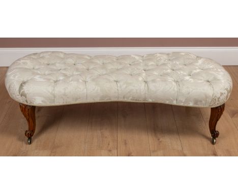 The shaped top with damask button upholstery, raised on cabriole legs with scrolling feet and brass castors.140cm wide x 62cm