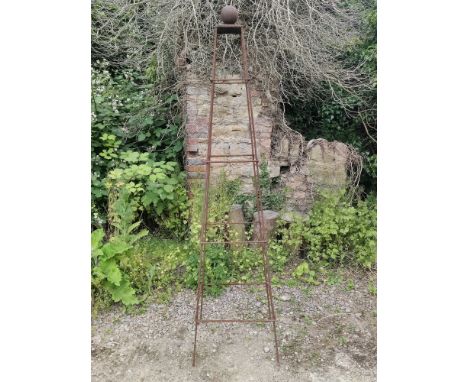 A square section wrought iron pyramidal plant support of tapering form, surmounted by a ball finial.52cm at the base x 210cm 
