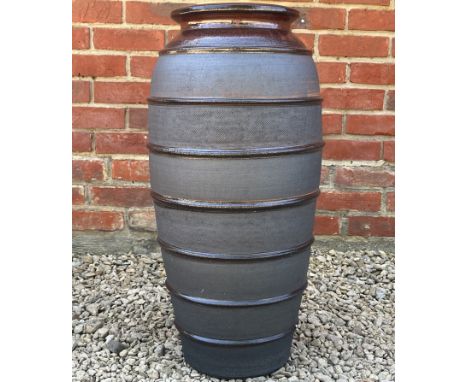 A stoneware garden jar or planter with ring turned ornament and glazed rim.32cm diameter x 67cm highSmall chip lower down oth