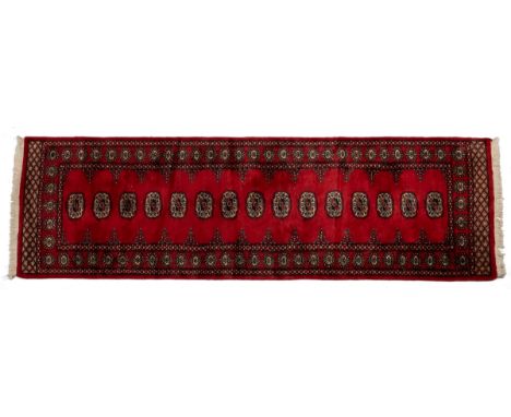 To include a Tekke Turkmen rug with three central decorations; a modern hand woven Persian style runner with a cream ground; 