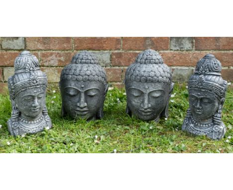 Two pairs of gray and black painted cast stone Buddha heads.First 23cm high; second 28cm highQty: 4Wear commensurate with age