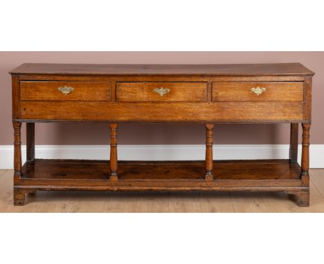 With three drawers above turned legs united by a pot shelf.180cm wide x 39cm deep x 82cm highWear commensurate with age and u