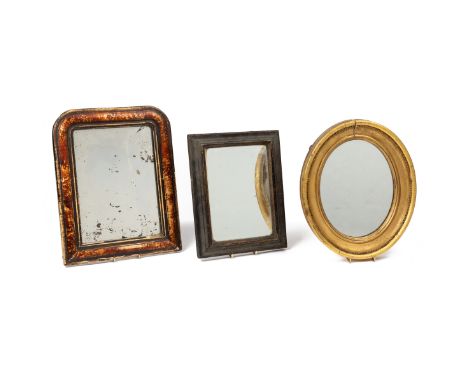 The first an oval mirror with a gilt frame, with beaded decoration; the second with an arched top and a wooden scumbled frame