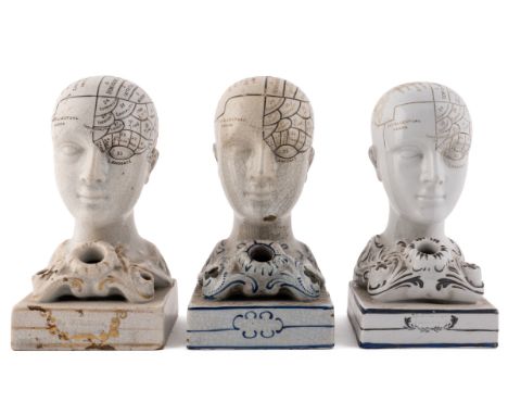 Modelled as phrenological heads, all embossed to the front of the plinth 'by F Bridges Phrenologist'.Each 14.5cm highQty: 3Th