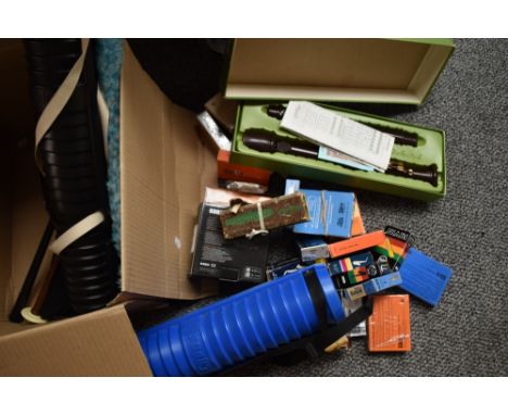 A box of assorted small instruments such as harmonicas etc including saxophone and clarinet reeds etc