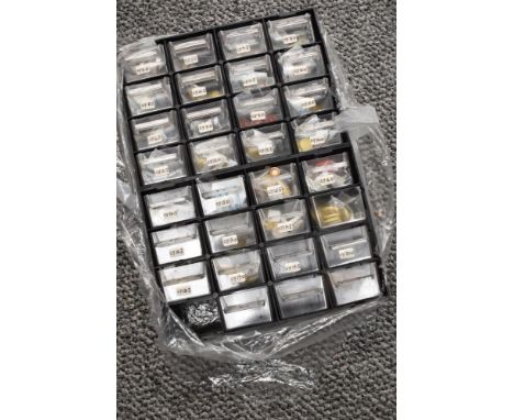 A small drawer set containing clarinet pads of various type