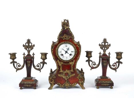 A late 19th century French red tortoiseshell and gilt metal garniture de cheminée mantel clock and candelabra, clock 17cm wid