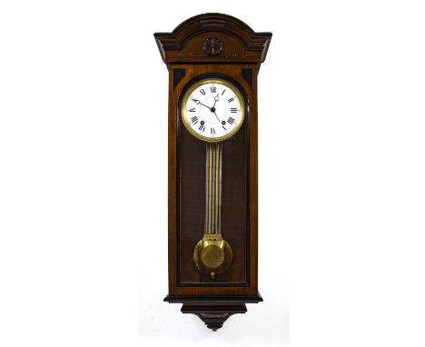 A late 19th century walnut and parcel ebonised regulator wall clock, the slightly convex white enamel Roman dial with Arabic 