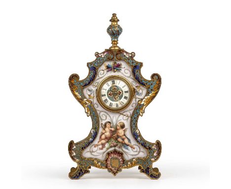 A late 19th century French gilt metal mantle clock with enamelled decoration and inset painted porcelain surround, an enamell