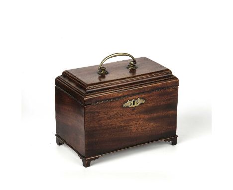 A George III mahogany tea caddy having a stepped rectangular top, a brass handle and escutcheon, enclosing three compartments
