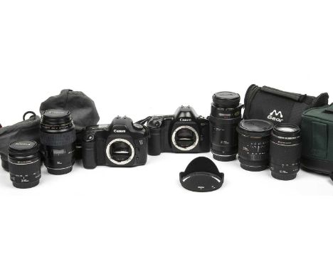 A Canon EOS 5D Camera outfit to include: camera body, Canon 28-80mm lens, Canon Macro lens EF 100mm f/2.8 USM. A Canon lens E