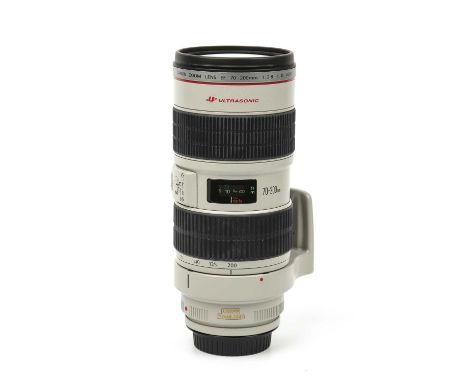 A Canon lens EF 70-200mm f/2.8 L IS USM with an ET-86 hood and caseCondition very good. No scratches. Minor discoloration to 