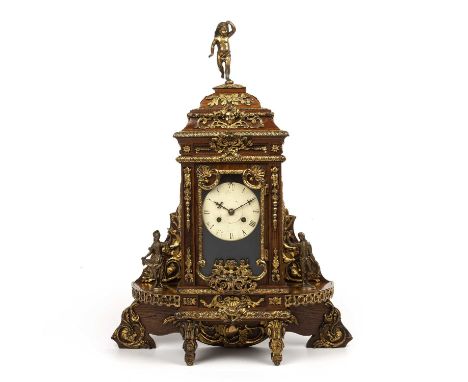 A late 19th century continental oak cased mantle clock with gilt metal figural decoration. 46cm wide 60cm high.The Robin, Par