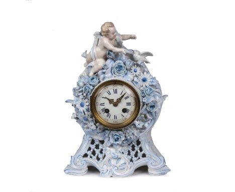 A 19th century French porcelain mantel clock encrusted with a cherub and flowers, having an enamelled dial with Arabic and Ro