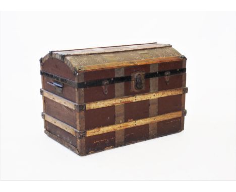 A late 19th/early 20th century domed steamer trunk, applied with wooden slats,iron swing handles and clasp locks, 54cm H x 76