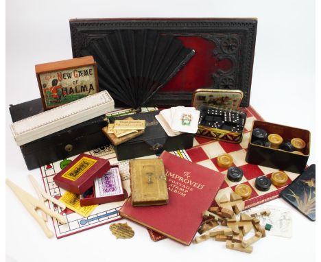 A selection of vintage games and game boards, to include, a Victorian leather gilt tooled chess board board, the cover design