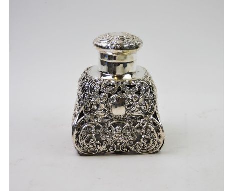 An Edwardian silver overlay inkwell, probably William Comyns &amp; Sons, London 1906, the moulded glass body of square form w