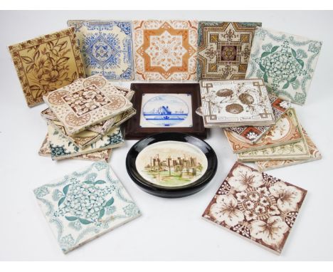 A collection of seventeen 19th century and later ceramic tiles, decorated with various floral and geometric patterns, each ap