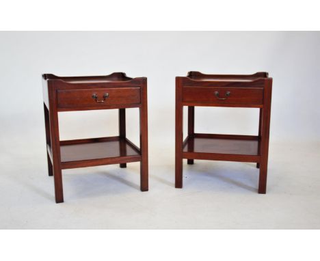 A pair of mahogany lamp/bedside tables, 20th century, each with a galleried top above a single frieze drawer and lower shelf,