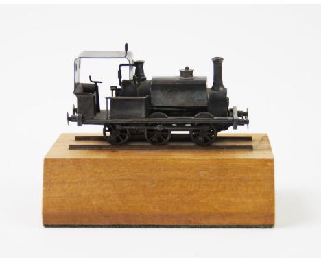 A novelty silver steam locomotive, 'P C', London 1982, the model train with driver's compartment detail, to include a coal fi