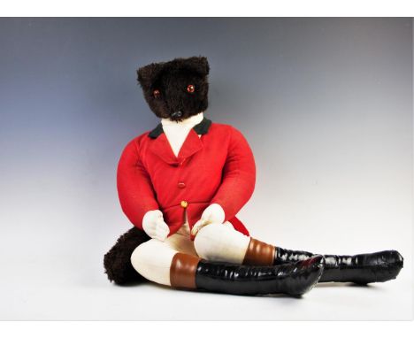 A hunting fox soft toy, by Casa Roma, modelled in a seated position wearing red riding jacket, jodhpurs and simulated leather