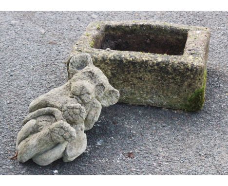 A reconstituted stone rectangular trough, 16cm H x 46cm W x 37cm D, along with a reconstituted garden ornament modelled as a 