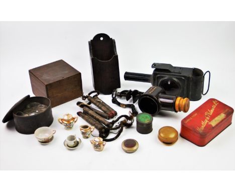A vintage 'Scout' carbide lamp, a boxed vintage food mincer,a collection of watch lenses to a tin, a 19th century oak candle 