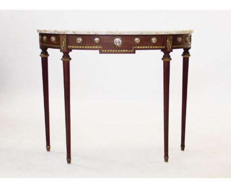 A Regency style marble top console table, mid 20th century, with a demi lune marble top above a frieze applied with ceramic r