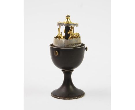 A novelty silver egg timer, Anthony Gordon Elson, London 1980, designed as an egg cup and removable egg shell cover, with gil
