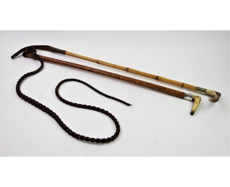 A horn handled hunting whip with a white metal mount embossed with huntsman and hounds, the hardwood shaft extending to a pla