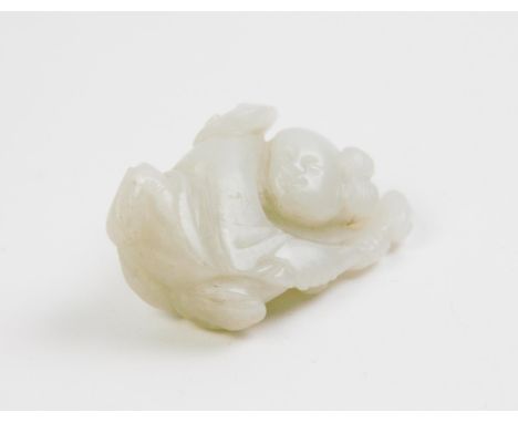 A Chinese white jade figure of a boy holding a ruyi branch, 4.2cm highFor condition information please view this lot on our w