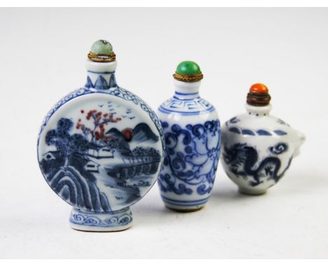 Three Chinese porcelain snuff bottles, comprising; a moon flask example, Kangxi four character mark, 9.5cm high, a blue and w