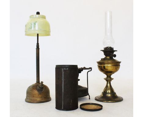 Two Victorian brass oil lamps, including a reeded column lamp with yellow glass shade, a second lamp, a cased primus stove an