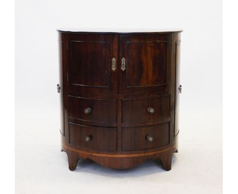 A George III bow front side cabinet, with a pair of central convex cupboard doors above four drawers, the sides of the cabine