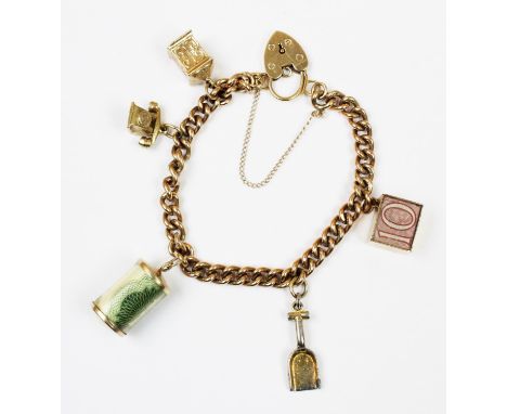 A 9ct gold charm bracelet, the curb link bracelet with heart shaped padlock fastener, with attached 9ct gold charms including