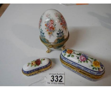 Two porcelain patch boxes and an egg shaped trinket box. 