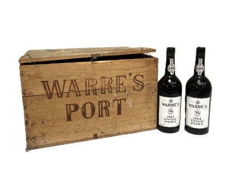 VINTAGE PORT: A case of Warre&rsquo;s Vintage Port, 1963,

(only eleven bottles), in original wooden crate and straw covers, 