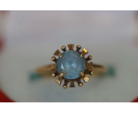 9ct Gold Ring set with Light Blue Stone 