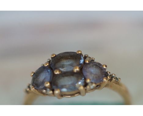 9ct Gold Ring set with 4 Light Purple Stones 