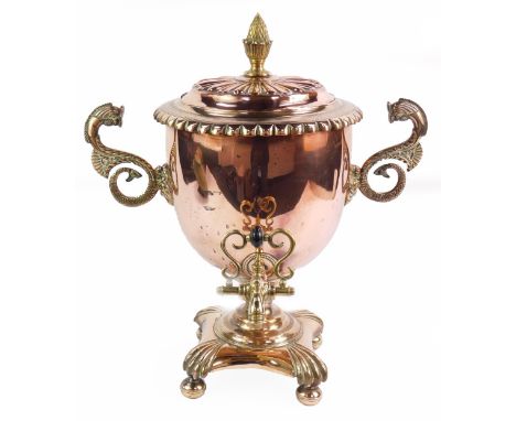 A Regency copper and brass samovar tea urn, of twin handled baluster form, the fluted lid with pineapple finial, body with se