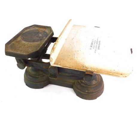 A set of H Webb cast iron and ceramic kitchen scales, with weights. 