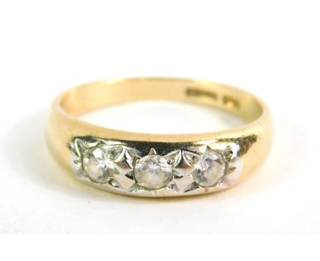 A 9ct gold and zircon three stone ring, size Q/R, 2.7g.